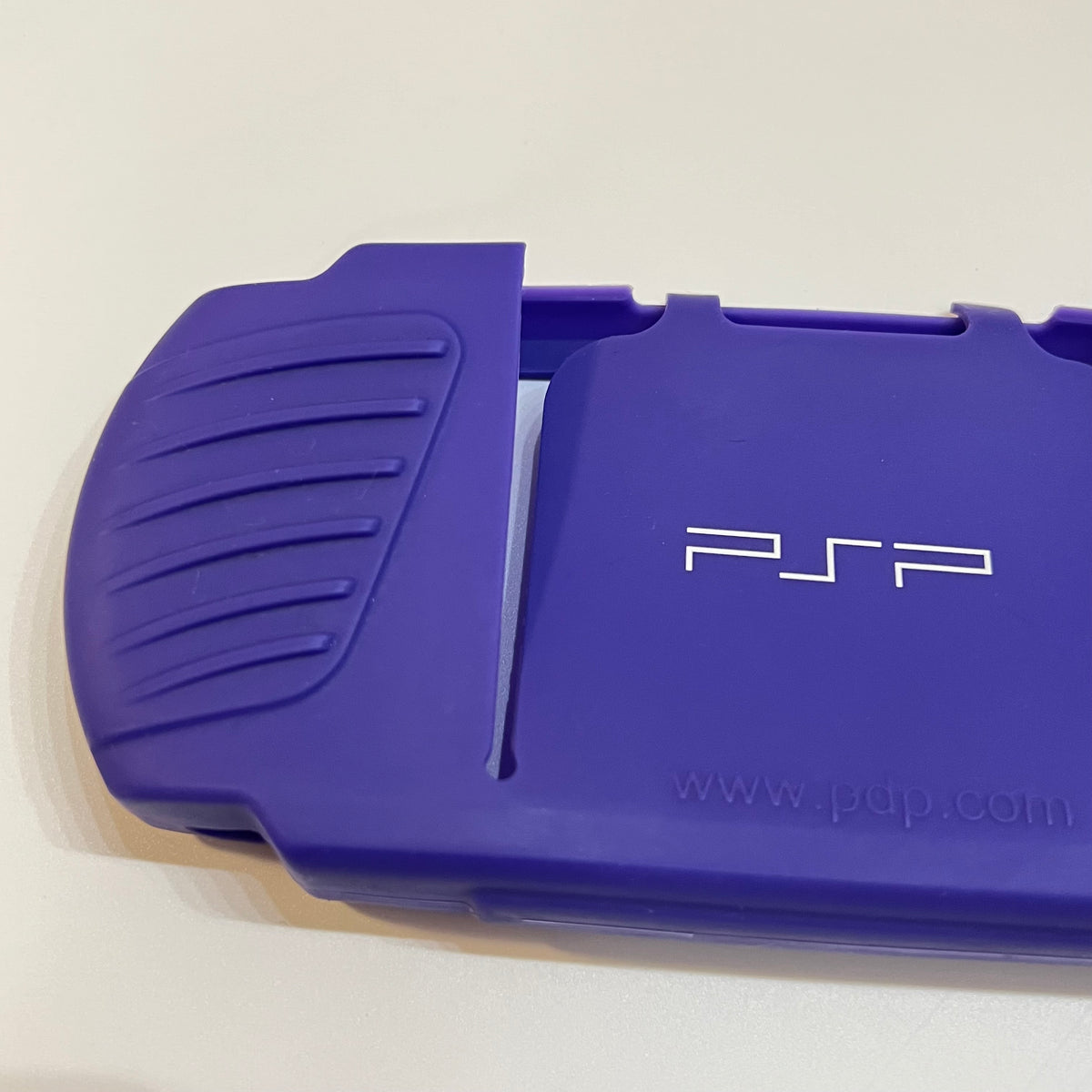 Purple pdp PSP 3000 Silicone Sleeve (small tear)