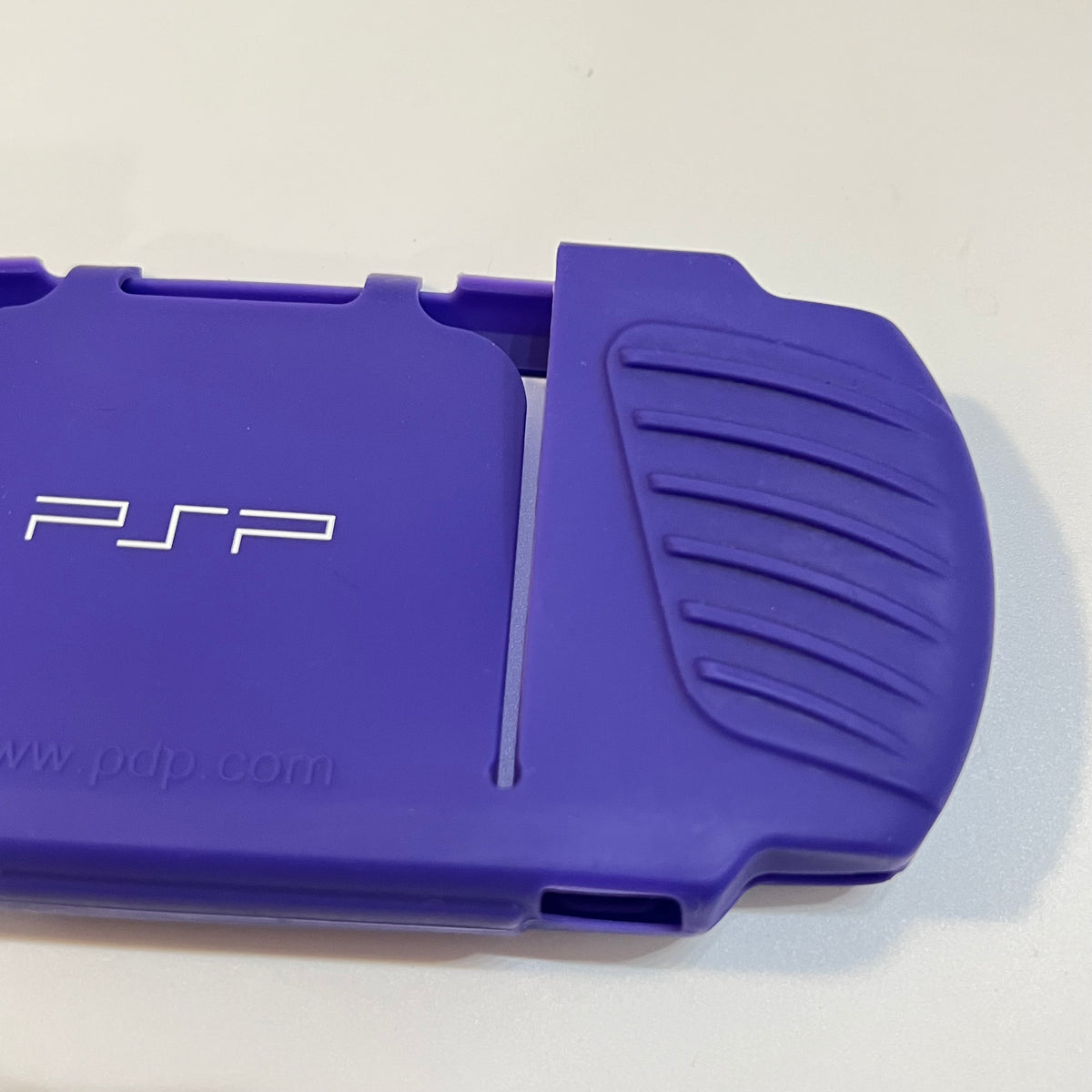 Purple pdp PSP 3000 Silicone Sleeve (small tear)